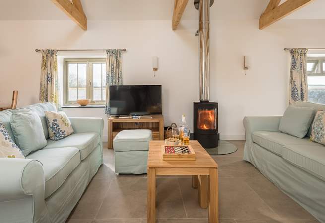 When the weather is not so good sit around the cosy wood-burner and enjoy the glow, however, the under-floor heating will also keep you warm.