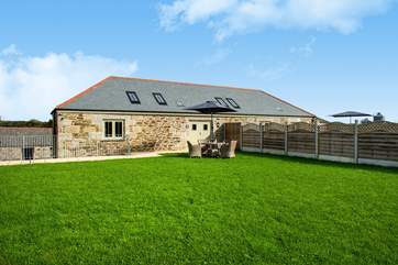 The Cow Shed is the barn on the left, with private parking for guests to the left of the photo.