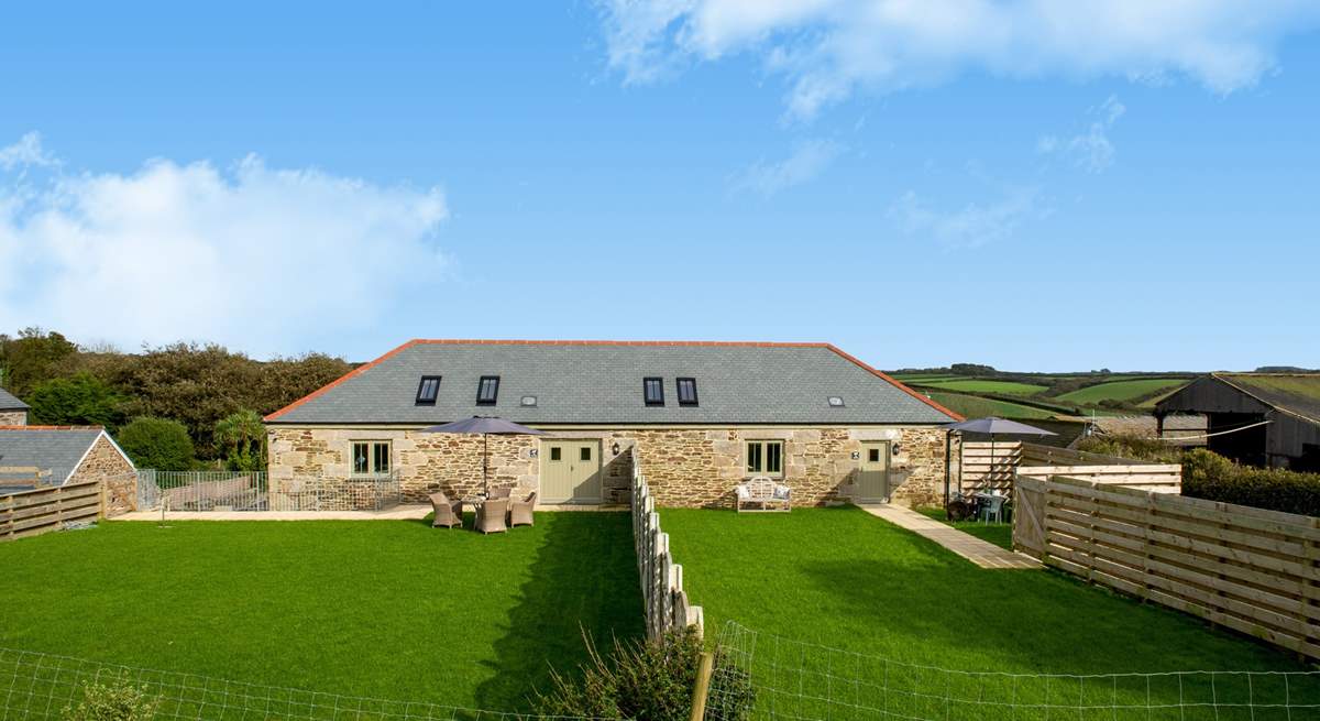 The Bull Pen is the barn on the right of the picture and has parking alongside the garden and  views over the farmyard and fields beyond. 