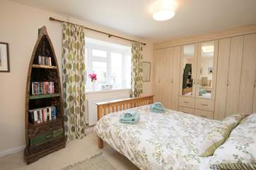 The gorgeous master bedroom with a king-size bed.