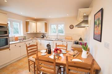 Within the well-equipped kitchen is a lovely place to sit and enjoy holiday meals together.