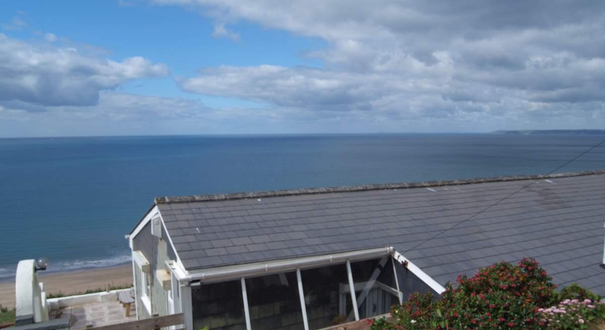 The bungalow is down below the level of the road.