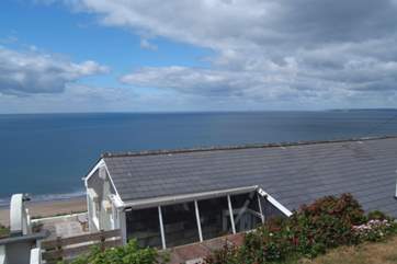 The bungalow is down below the level of the road.