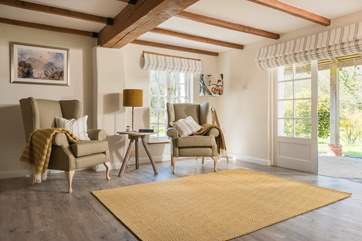 Open the double doors in the sitting-room overlooking the large garden.