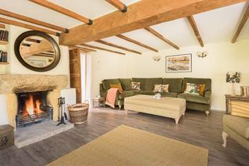 The green tones and botanical themes link the inside and outside in the sitting-room.