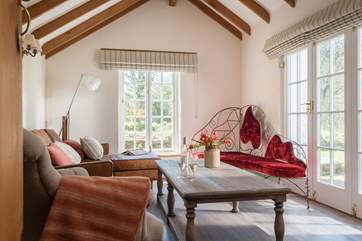 The second sitting-room is the perfect place to watch the wildlife (with a glass of wine).