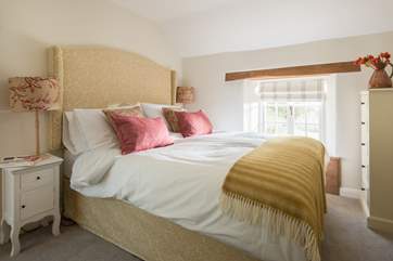 The third bedroom has warm and calm tones.
