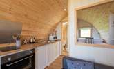 The kitchen has everything you need for your glamping getaway.  - Thumbnail Image