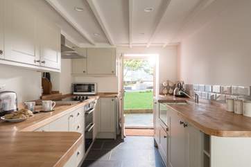 A door leads from the kitchen-area out to the garden.