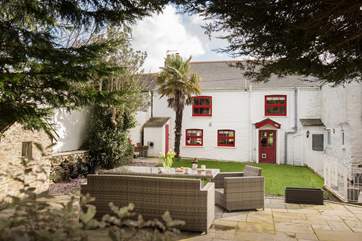 The raised dining terrace in the back garden.