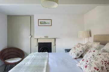 Lots of original features in the cottage, such as this lovely Victorian fire surround.