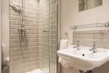 The shower-room has a drench head shower.