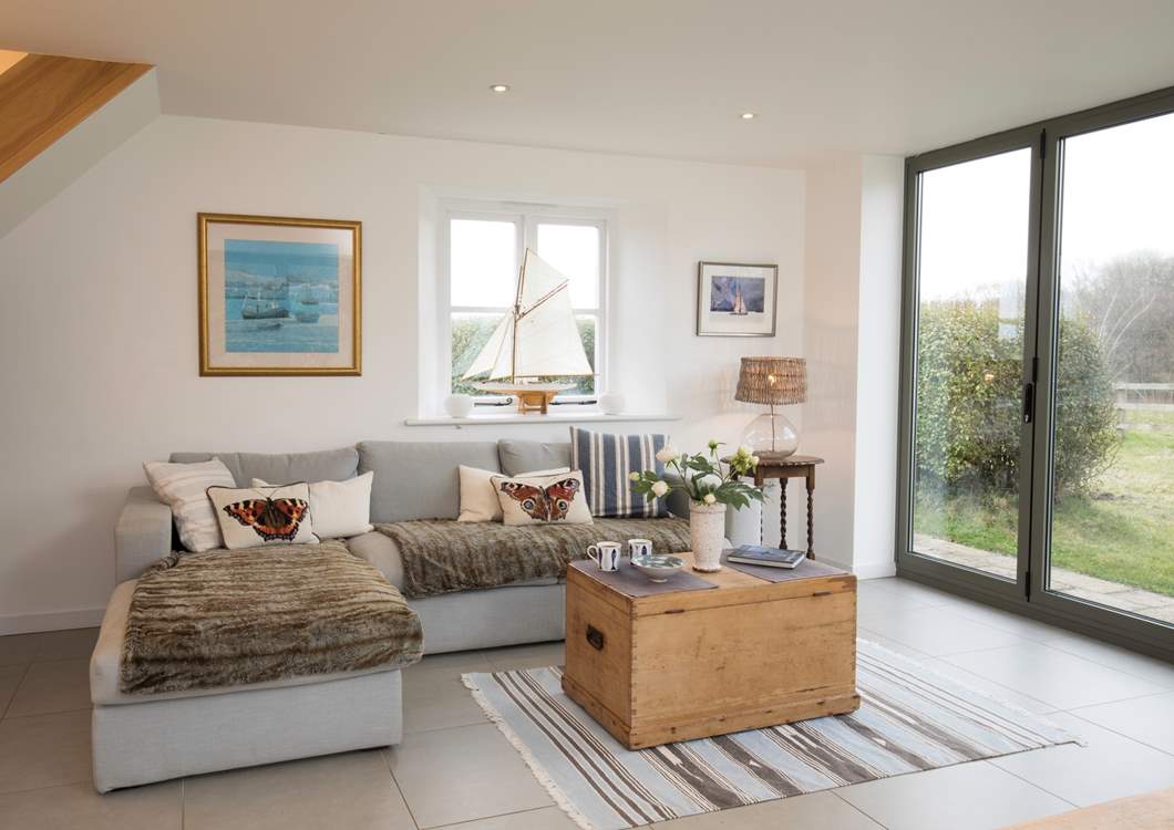 The living/dining area is an extension to the original cottage, with modern under-floor heating.