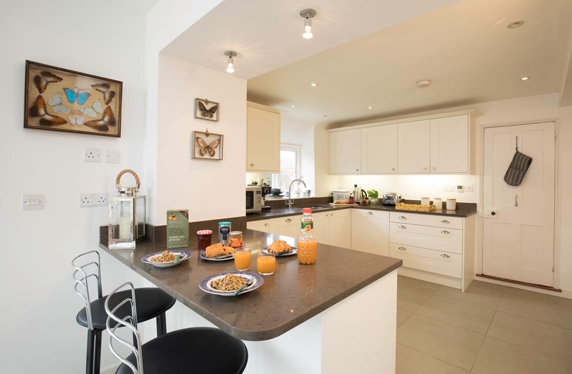 The impressive kitchen/dining area is a fabulous place for entertaining and cooking.