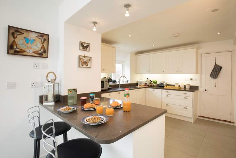 The impressive kitchen/dining area is a fabulous place for entertaining and cooking.