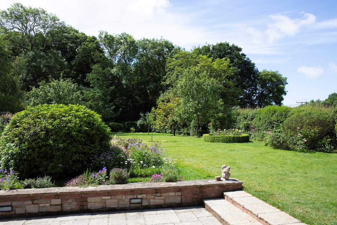 Doors from the living/dining room lead out to the beautiful gardens.