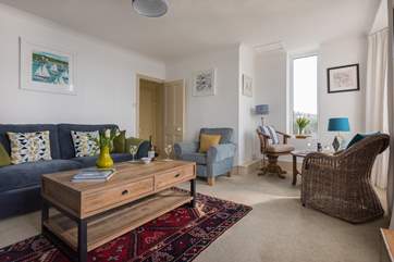 The sitting-room stretches the width of the cottage.