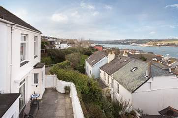 3 Thetis Place is the end of a small terrace of three cottages accessed through a private gateway onto their shared terrace, the house is now also painted blue.