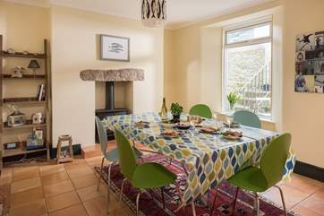 The spacious kitchen/dining-room has a wood-burner (great for cosy meals in cooler months).