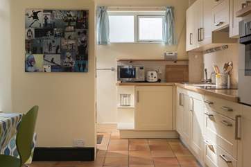 The kitchen area is fully equipped with all you could need for holiday living.