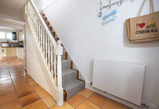 The steep stairs lead to the sitting-room which has amazing views, along with the family shower-room and second bedroom. 