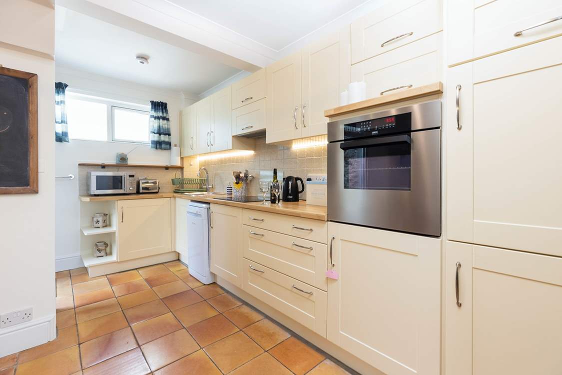 The kitchen is well-equipped for all your needs and the back door opens into a sheltered, private courtyard.