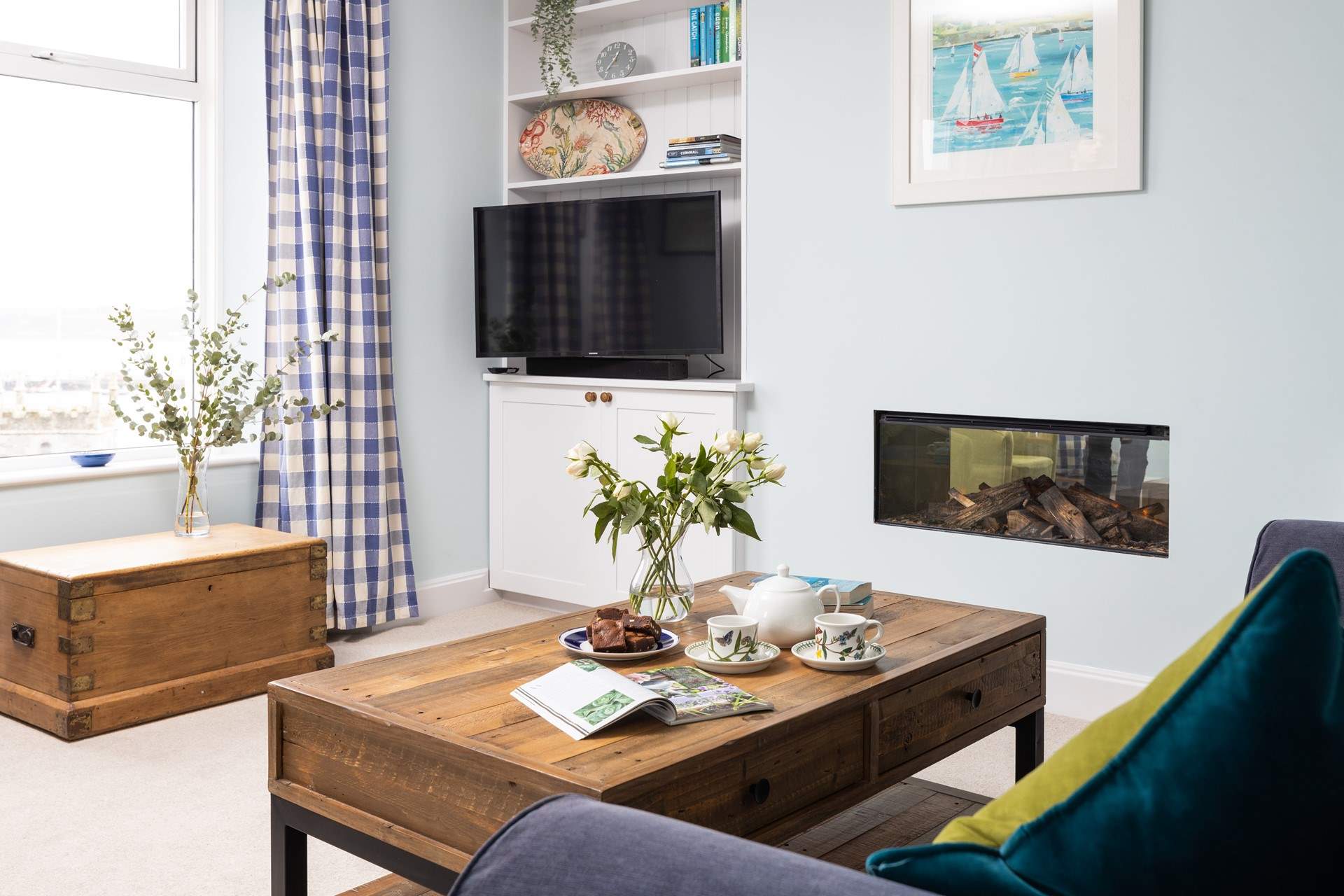 The gorgeous sitting-room has far reaching views over the water. 