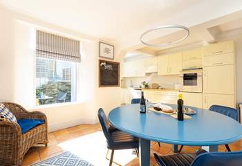 The open plan kitchen/diner catches the afternoon light. 
