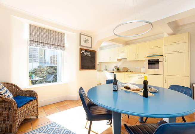 The open plan kitchen/diner catches the afternoon light. 