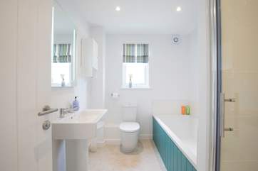 Family bathroom with bath and separate shower cubicle.
