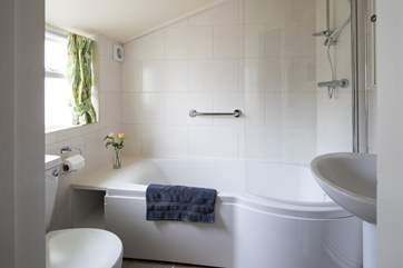 The ground floor bathroom has a fitted shower and heated towel rail.