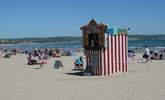 The safe, sandy beach at Weymouth still has a traditional Punch and Judy show in the summer months. - Thumbnail Image