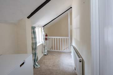 Pitched ceilings on the first floor add to the charm of this delightful cottage.