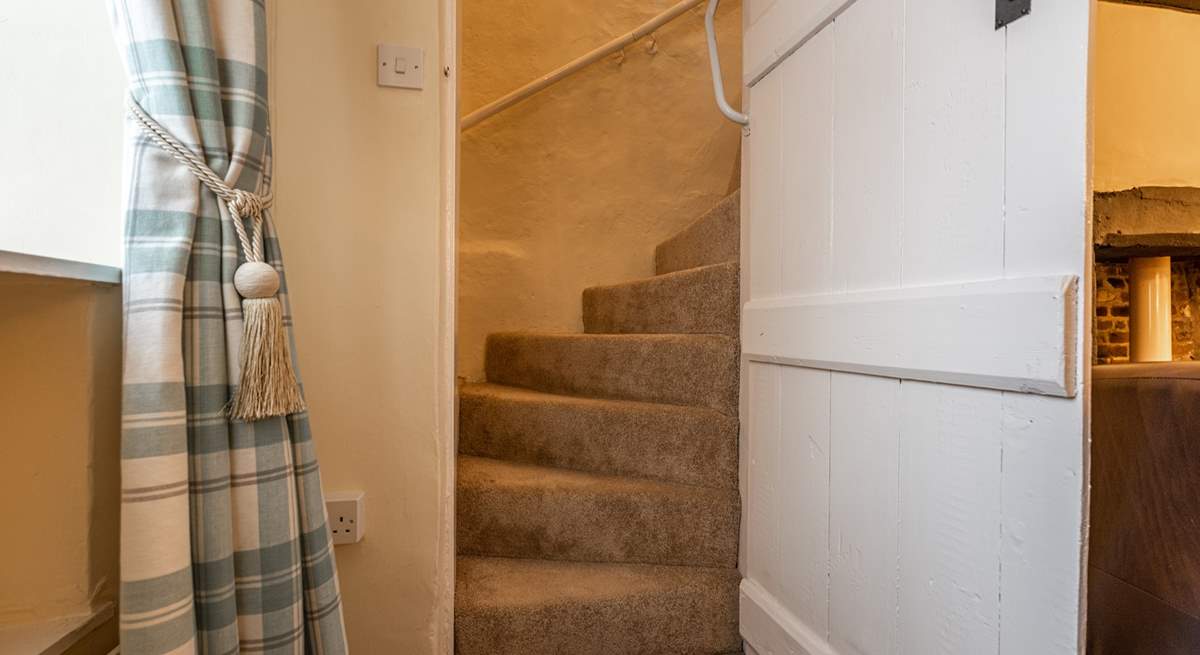 A view of the stairs with the traditional door. Should you wish to use a stair-gate, you will need to place it at the door of the twin room. 