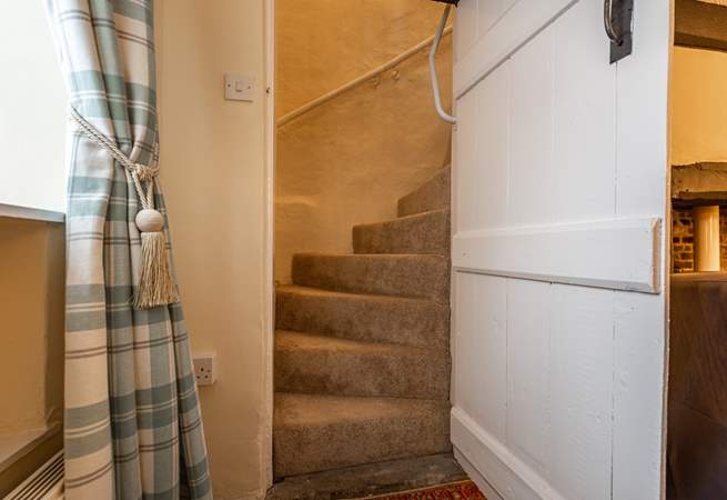 A view of the stairs with the traditional door. Should you wish to use a stair-gate, you will need to place it at the door of the twin room. 