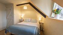 This pretty bedroom can either be made up as a king-size double bed (5') or two 2'6