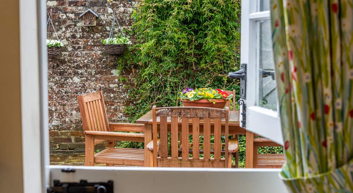 The kitchen has a characterful stable-door leading out to the pretty courtyard.