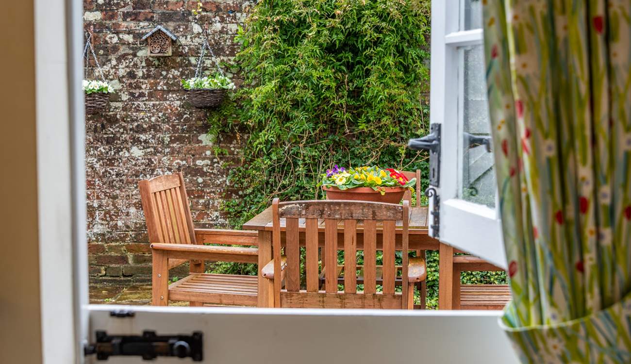 The kitchen has a characterful stable-door leading out to the pretty courtyard.