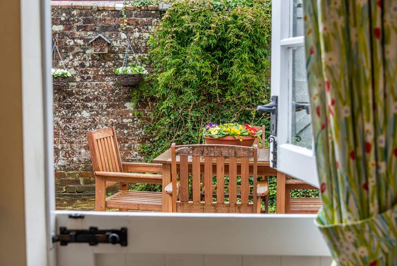 The kitchen has a characterful stable-door leading out to the pretty courtyard.