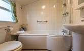 The modern ground-floor bathroom is a lovely bright space. - Thumbnail Image