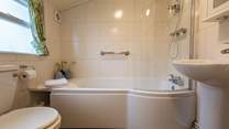 The modern ground-floor bathroom is a lovely bright space.