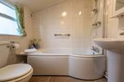 The modern ground-floor bathroom is a lovely bright space.