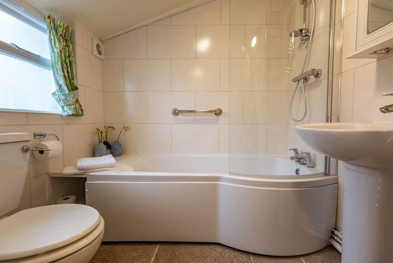 The modern ground-floor bathroom is a lovely bright space.