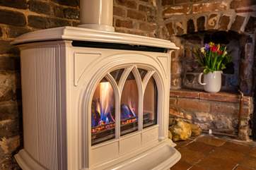 You will find it difficult to tear yourself away from this lovely wood-burner effect gas stove.