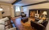 Sit back and relax in the sitting-room which has a gorgeous original inglenook fireplace with a delightful wood-burner effect gas stove. - Thumbnail Image