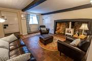 Sit back and relax in the sitting-room which has a gorgeous original inglenook fireplace with a delightful wood-burner effect gas stove.
