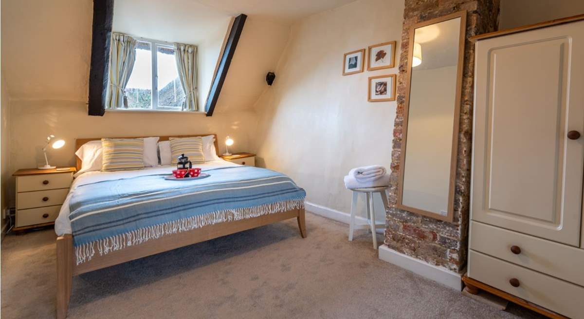 The master bedroom has a king-size double bed and lovely soft linens.