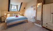 The master bedroom has a king-size double bed and lovely soft linens.