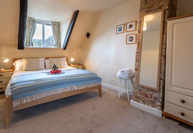 The master bedroom has a king-size double bed and lovely soft linens.