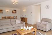 Another view of the sitting-room where there is comfortable seating for all.